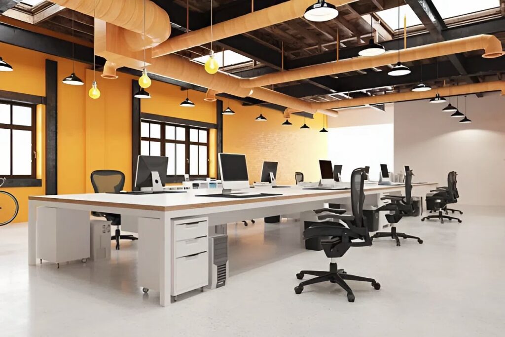 Bright open-plan office with bold yellow accent walls painted by an interior painter in Bexley, OH