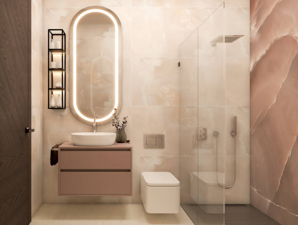 Soft blush pink painted vanity cabinets and warm ivory walls by a house painter in Delaware, OH