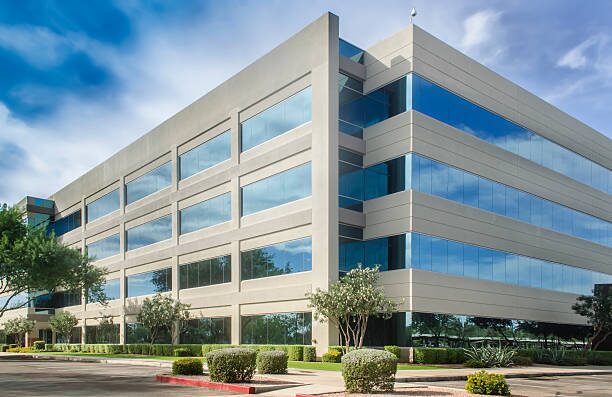 Commercial office building with light gray exterior panels and crisp architectural lines by an exterior painter in Columbus, OH