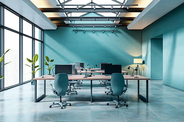 Office interior with soft teal walls and smooth painted finishes by a painting company in Columbus, OH.
