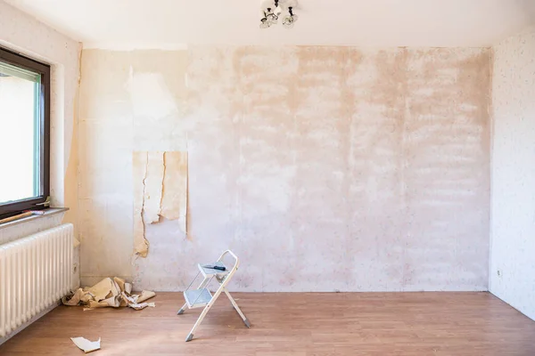 Wallpaper removal and wall preparation before interior painting in Worthington, OH.