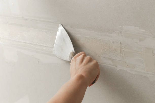 Drywall repair and preparation before painting a home with an interior painter in Galena, OH