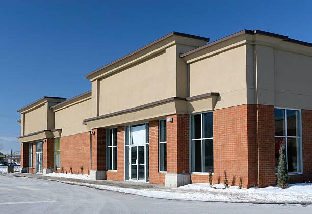 Building with red brick beige stucco paint finishes and contrasting trim by a painting company in Powell, OH